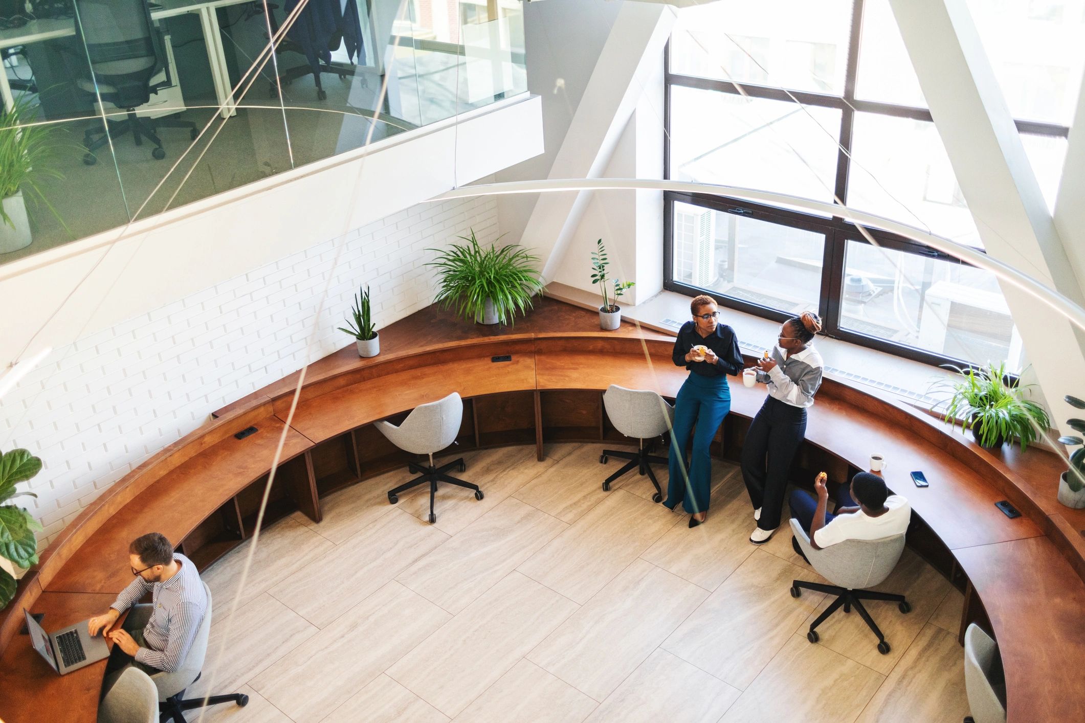 Colleagues chatting during a break in a modern office